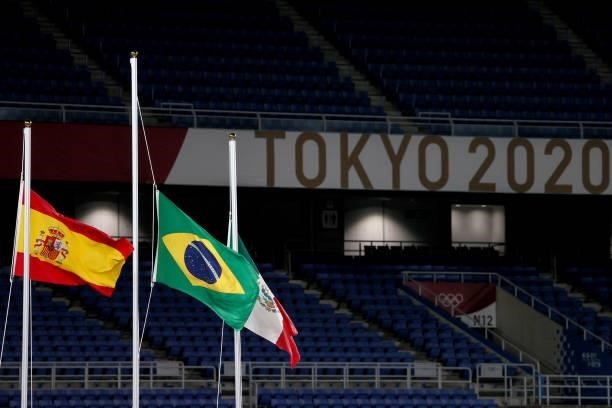 Raising the flags for the three winning teams during the Men's Football Competition Medal Ceremony on day fifteen of the Tokyo 2020 Olympic Games at...