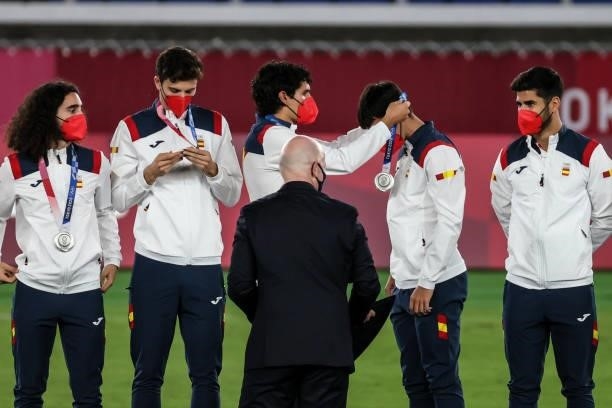 Silver medalists of Team Spain celebrate on the podium with their medals during the Men's Football Competition Medal Ceremony on day fifteen of the...