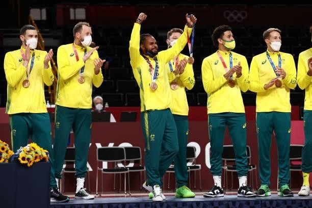 Patty Mills and the Australia Men's National Team celebrate during the Medal Ceremony of the 2020 Tokyo Olympics at the Saitama Super Arena on August...