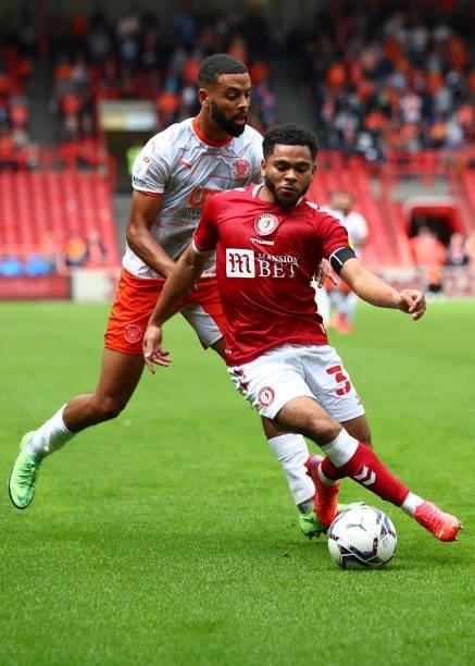 Jay Dasilva of Bristol City in action with CJ Hamilton of Blackpool during the Sky Bet Championship match between Bristol City and Blackpool at...