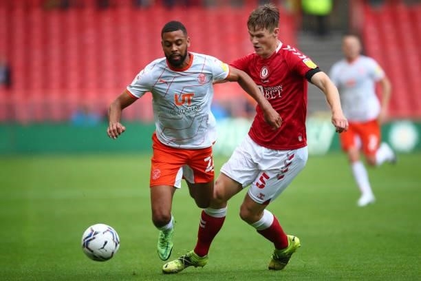 Hamilton of Blackpool in action with Robert Atkinson of Bristol City during the Sky Bet Championship match between Bristol City and Blackpool at...