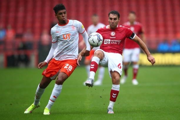 Tyreece John-Jules of Blackpool in action with Matty James of Bristol City during the Sky Bet Championship match between Bristol City and Blackpool...