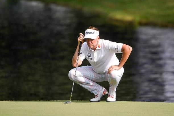 Ian Poulter of England lines up his putt at the 18th hole during the third round of the World Golf Championships-FedEx St. Jude Invitational at TPC...