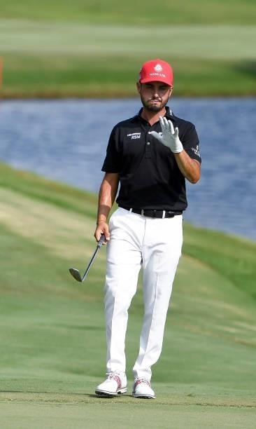 Abraham Ancer of Mexico waves at the 18th hole during the third round of the World Golf Championships-FedEx St. Jude Invitational at TPC Southwind on...