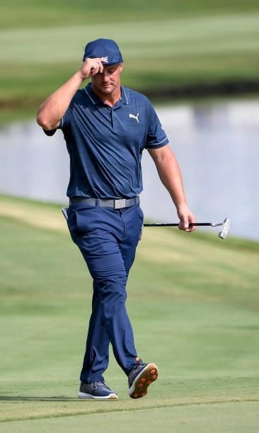Bryson DeChambeau tips his hat to the crowd at the 18th hole during the third round of the World Golf Championships-FedEx St. Jude Invitational at...
