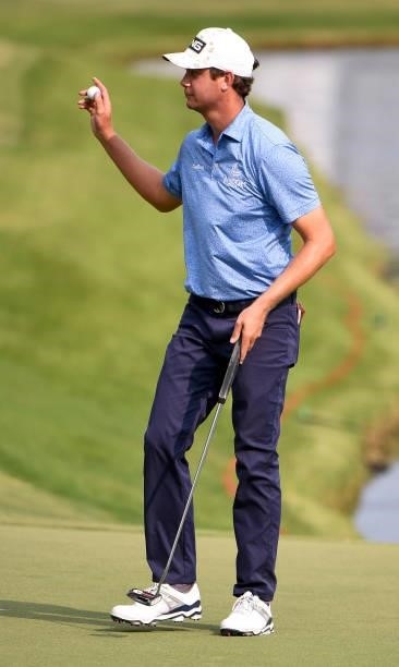 Harris English waves his ball to the 18th hole during the third round of the World Golf Championships-FedEx St. Jude Invitational at TPC Southwind on...