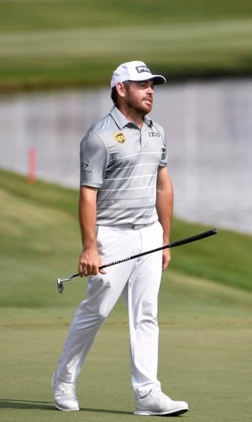 Louis Oosthuizen of South Africa reacts after missing his birdie putt at the 18th hole during the third round of the World Golf Championships-FedEx...