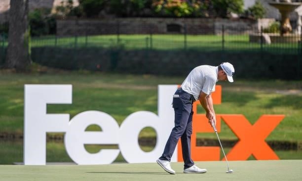 Jim Herman makes finished out his putt at the ninth hole during the third round of the World Golf Championships-FedEx St. Jude Invitational at TPC...