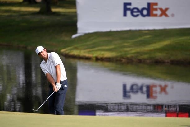 Scottie Scheffler chips up to the 18th green during the third round of the World Golf Championships-FedEx St. Jude Invitational at TPC Southwind on...
