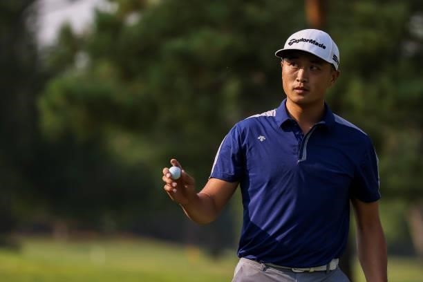 Bobby Bai of China acknowledges the crowd after sinking his putt on the 18th green during the third round of the Utah Championship presented by Zions...