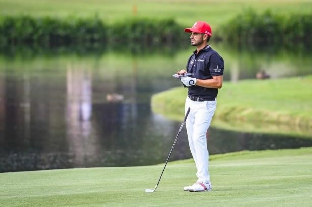 Abraham Ancer of Mexico checks his yardage book on the 12th hole during the third round of the World Golf Championships-FedEx St. Jude Invitational...