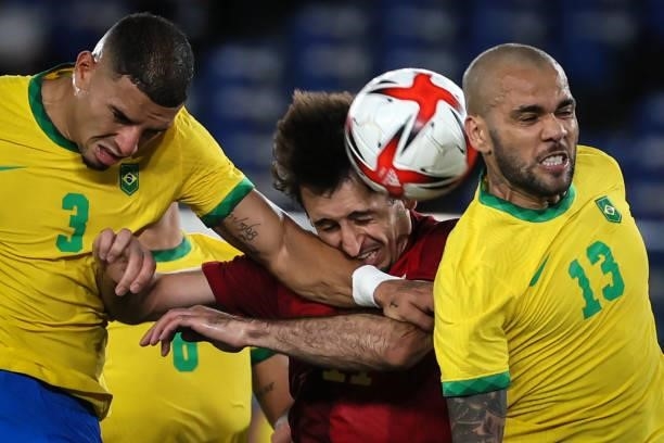 Dani ALVES and CARLOS DIEGO of Team Brazil competes for the ball with Mikel OYARZABAL of Team Spain during The match between Brazil and Spain on day...