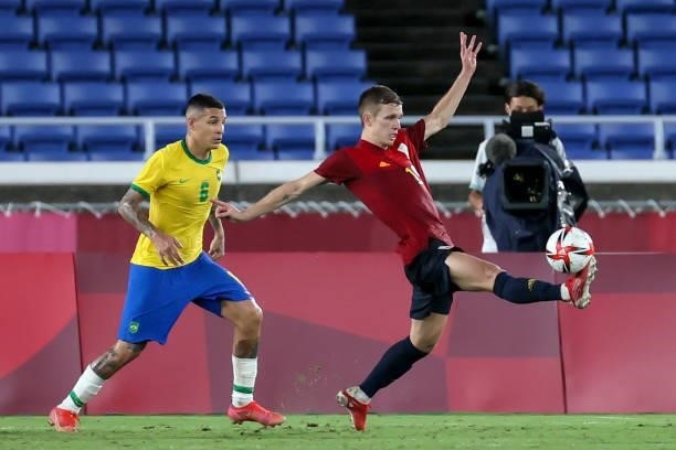 Guilherme ARANA of Team Brazil competes for the ball with Dani OLMO of Team Spain during The match between Brazil and Spain on day Fifteenth of the...