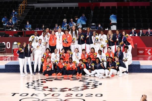 The Japan Women's National Team, The USA Basketball Womens National Team and The France Women's National Team look on after the Gold Medal Game of...