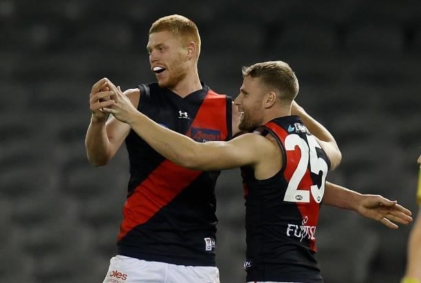 Peter Wright and Jake Stringer of the Bombers celebrate during the 2021 AFL Round 21 match between the Western Bulldogs and the Essendon Bombers at...
