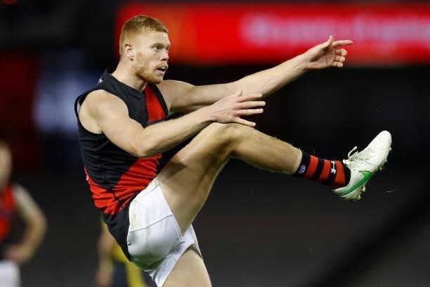 Peter Wright of the Bombers kicks a goal during the 2021 AFL Round 21 match between the Western Bulldogs and the Essendon Bombers at Marvel Stadium...
