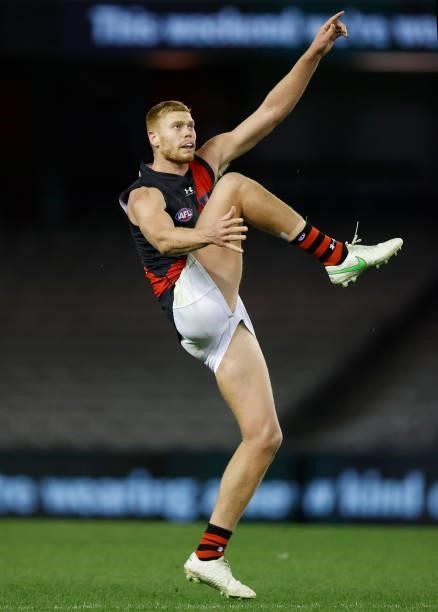 Peter Wright of the Bombers kicks for goal during the 2021 AFL Round 21 match between the Western Bulldogs and the Essendon Bombers at Marvel Stadium...