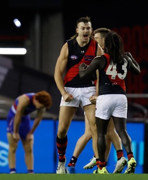 Sam Draper and Anthony McDonald-Tipungwuti of the Bombers celebrate during the 2021 AFL Round 21 match between the Western Bulldogs and the Essendon...