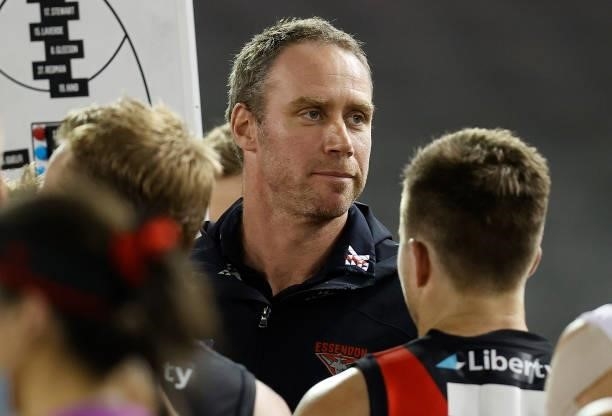 Ben Rutten, Senior Coach of the Bombers addresses his players during the 2021 AFL Round 21 match between the Western Bulldogs and the Essendon...