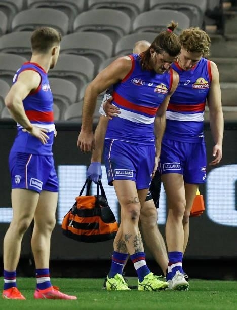 Josh Bruce and Aaron Naughton of the Bulldogs are seen after the 2021 AFL Round 21 match between the Western Bulldogs and the Essendon Bombers at...