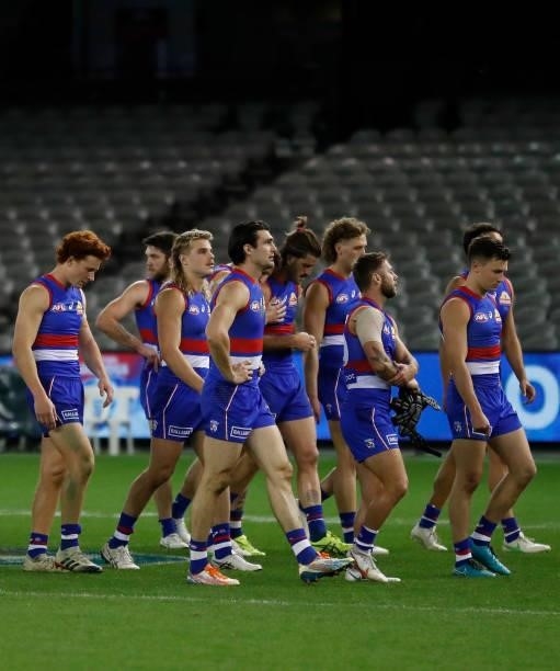 The Bulldogs look dejected after a loss during the 2021 AFL Round 21 match between the Western Bulldogs and the Essendon Bombers at Marvel Stadium on...