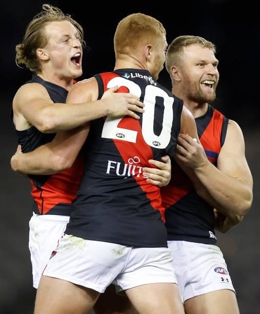 Mason Redman, Peter Wright and Jake Stringer of the Bombers celebrate during the 2021 AFL Round 21 match between the Western Bulldogs and the...