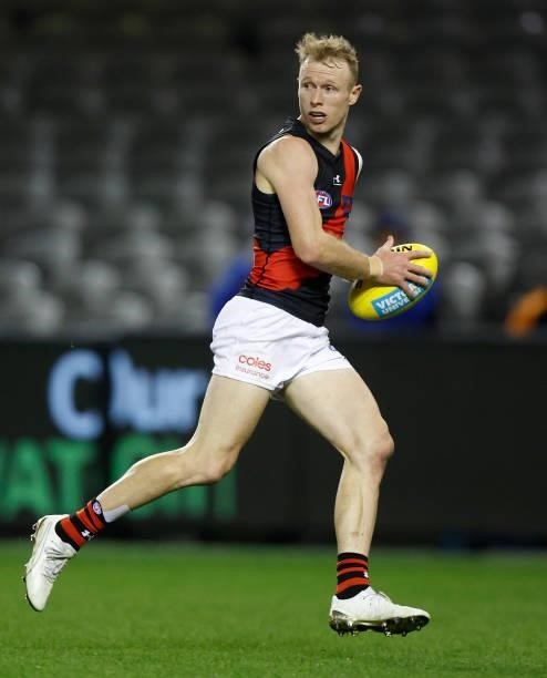 Nick Hind of the Bombers in action during the 2021 AFL Round 21 match between the Western Bulldogs and the Essendon Bombers at Marvel Stadium on...