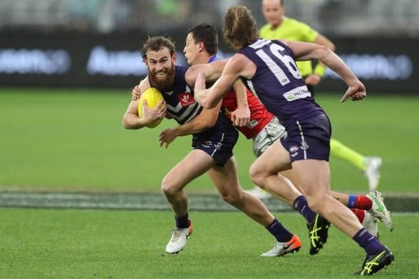 Connor Blakely of the Dockers looks to pass the ball during the 2021 AFL Round 21 match between the Fremantle Dockers and the Brisbane Lions at Optus...