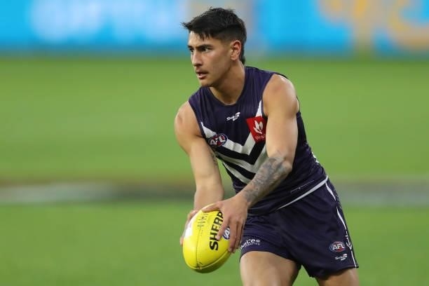 Joel Western of the Dockers looks to pass the ball during the 2021 AFL Round 21 match between the Fremantle Dockers and the Brisbane Lions at Optus...