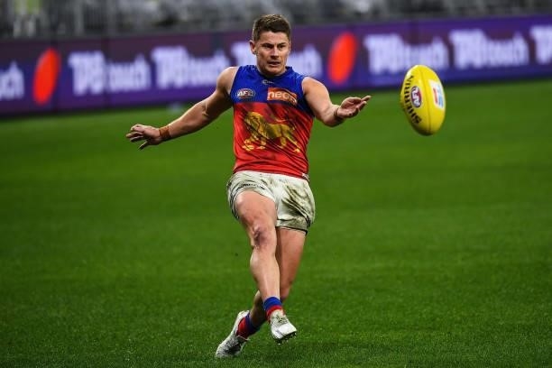 Dayne Zorko of the Lions kicks the ball during the 2021 AFL Round 21 match between the Fremantle Dockers and the Brisbane Lions at Optus Stadium on...