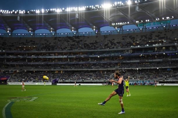 Alex Pearce of the Dockers kicks the ball during the 2021 AFL Round 21 match between the Fremantle Dockers and the Brisbane Lions at Optus Stadium on...
