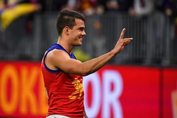 Brandon Starcevich of the Lions celebrates with the fans during the 2021 AFL Round 21 match between the Fremantle Dockers and the Brisbane Lions at...