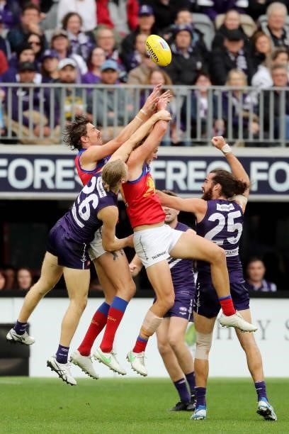 Joe Daniher of the Lions attempts a pack mark during the 2021 AFL Round 21 match between the Fremantle Dockers and the Brisbane Lions at Optus...