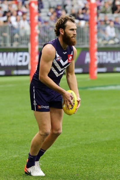 Connor Blakely of the Dockers looks to pass the ball during the 2021 AFL Round 21 match between the Fremantle Dockers and the Brisbane Lions at Optus...