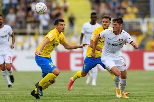 Luca Sirch of 1. FC Lokomotive Leipzig and Patrik Schick of Bayer 04 Leverkusen battle for the ball during the DFB Cup first round match between 1....