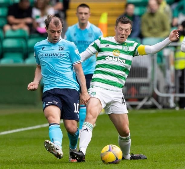 Dundee's Paul McGowan and Celtic's Callum McGregor during a cinch Premiership match between Celtic and Dundee at Celtic Park, on August 08 in...