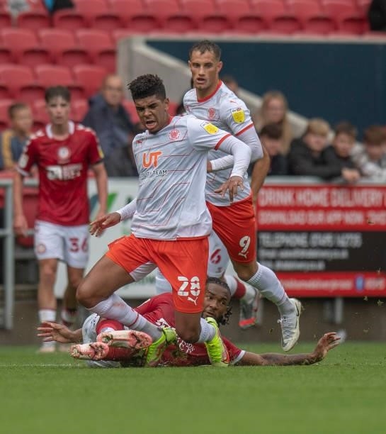 Blackpool's Tyreece John-Jules is tackled by Bristol City's Kasey Palmer during the Sky Bet Championship match between Bristol City and Blackpool at...