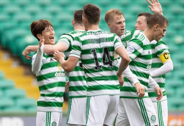 Kyogo Furuhashi of Celtic celebrates his second goal with teammates during the Cinch Scottish Premiership match between Celtic FC and Dundee FC at on...