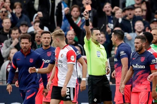 Referee Dennis Higler gives a red card to Yannick Carrasco of Atletico Madrid during the Club Friendly match between Feyenoord v Atletico Madrid at...