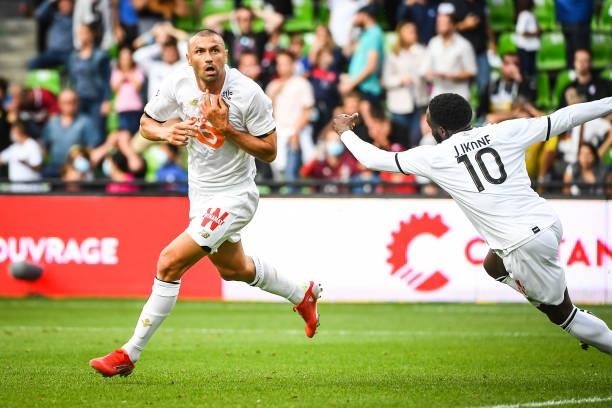 Burak YILMAZ of Lille celebrates his goal during the Ligue 1 football match between Metz and Lille at Stade Saint-Symphorien on August 8, 2021 in...