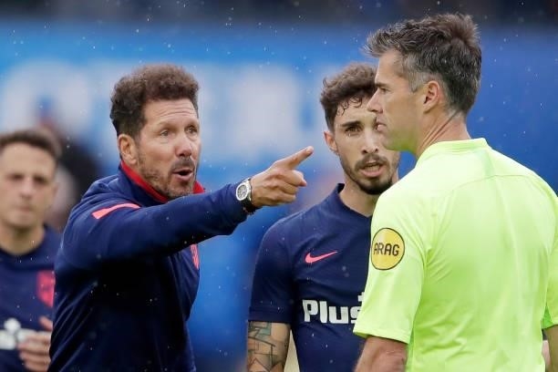 Coach Diego Simeone of Atletico Madrid, assistant referee Charl Schaap during the Club Friendly match between Feyenoord v Atletico Madrid at the...