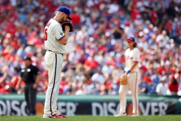 Pitcher Zack Wheeler of the Philadelphia Phillies stands behind the mound before the final out in the ninth inning against the New York Mets in a...