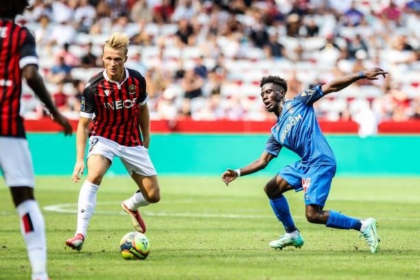 Kasper DOLBERG of Nice and Nathanael MBUKU of Reims during the Ligue 1 football match between Nice and Reims at Allianz Riviera on August 8, 2021 in...