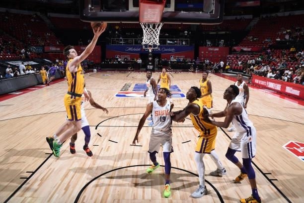 Austin Reaves of the Los Angeles Lakers drives to the basket against the Phoenix Suns during the 2021 Las Vegas Summer League on August 8, 2021 at...