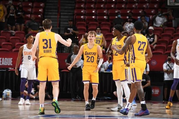 Mac McClung of the Los Angeles Lakers embraces his teammates during the 2021 Las Vegas Summer League on August 8, 2021 at the Thomas & Mack Center in...