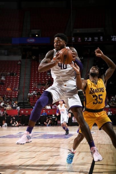 Tyrique Jones of the Phoenix Suns drives to the basket and looks to pass the ball against the Los Angeles Lakers during the 2021 Las Vegas Summer...