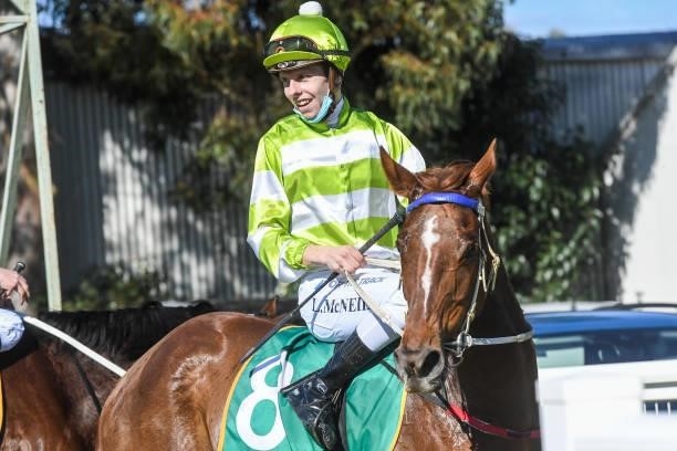 Logan McNeil returns to the mounting yard on Super Quick Love after winning the Midura & District Real Estate BM58 Handicap at Mildura Racecourse on...