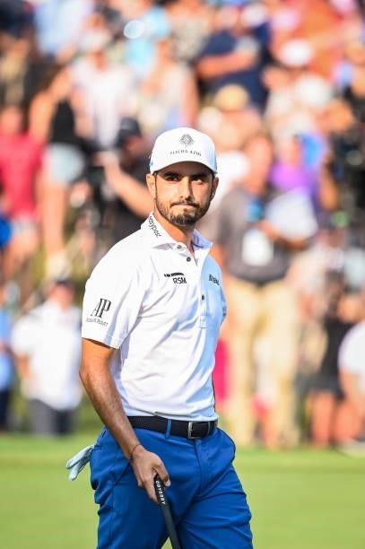 Abraham Ancer of Mexico smiles after making a birdie putt on the 18th hole green during a playoff in the final round of the World Golf...