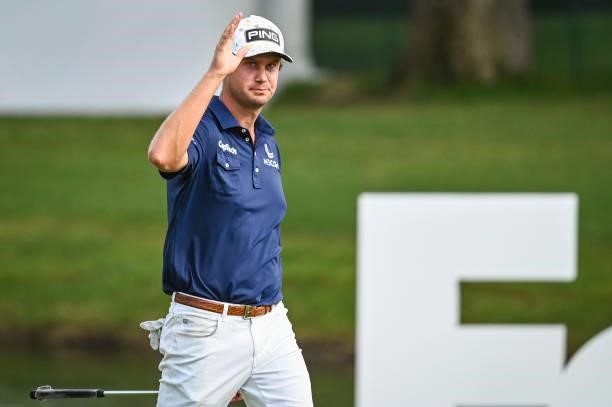 Harris English waves to fans on the 18th hole during the final round of the World Golf Championships-FedEx St. Jude Invitational at TPC Southwind on...