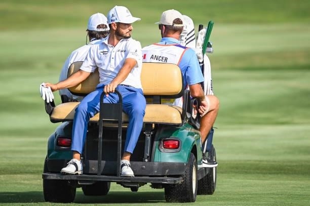 Abraham Ancer of Mexico rides in a cart to the 18th hole tee for a playoff during the final round of the World Golf Championships-FedEx St. Jude...
